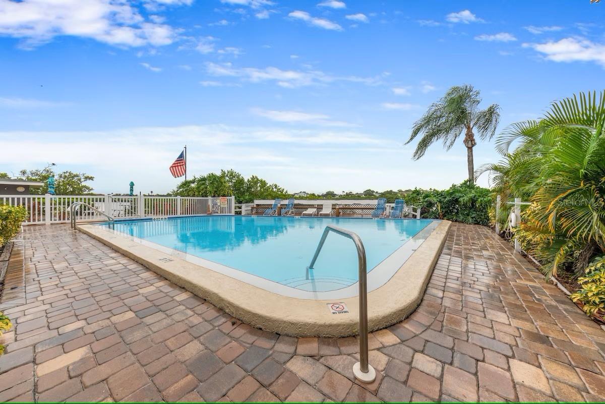 Relax in the heated community pool while enjoying breathtaking bay views.