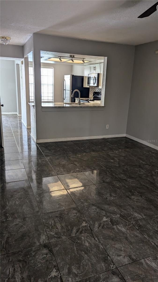 Glancing back toward the kitchen from sliding glass doors.