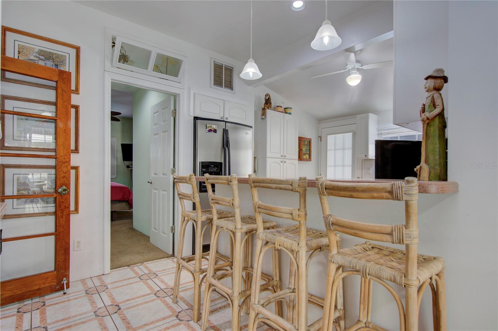 looking from dining room to kitchen with master beddroom through door straight ahead