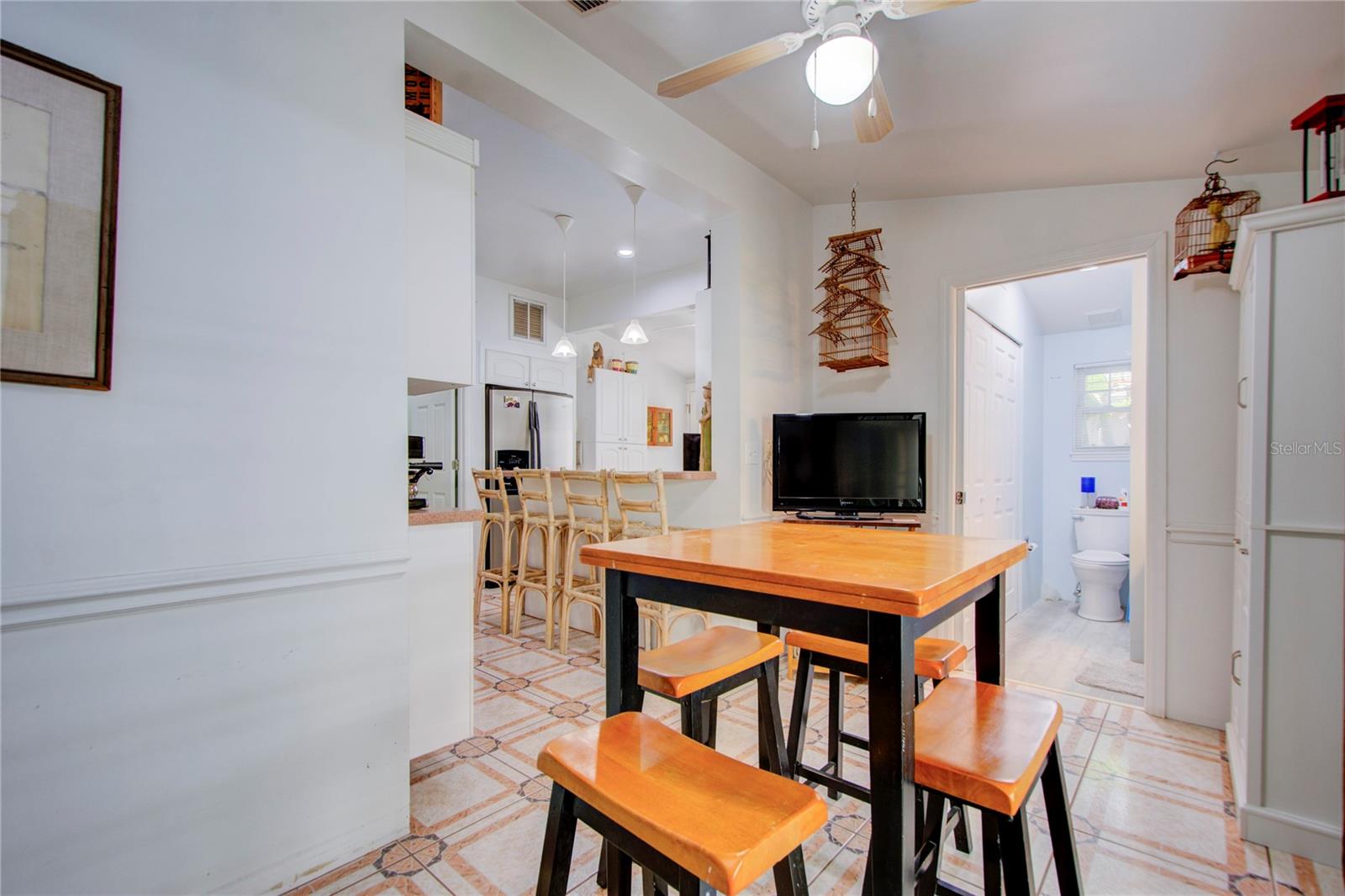 looking at dining room from patio door to kitchen and bath