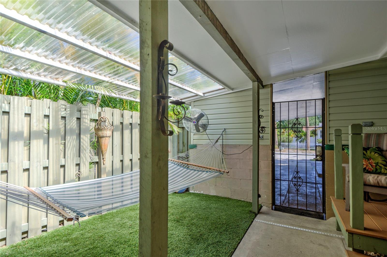 gate to carport from side porch area