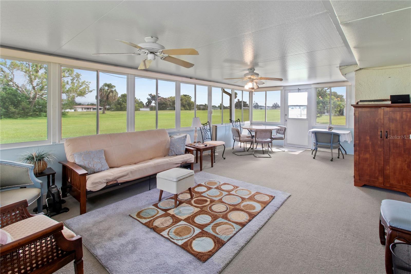 Spacious Florida Room in back of home, including fans and lights.