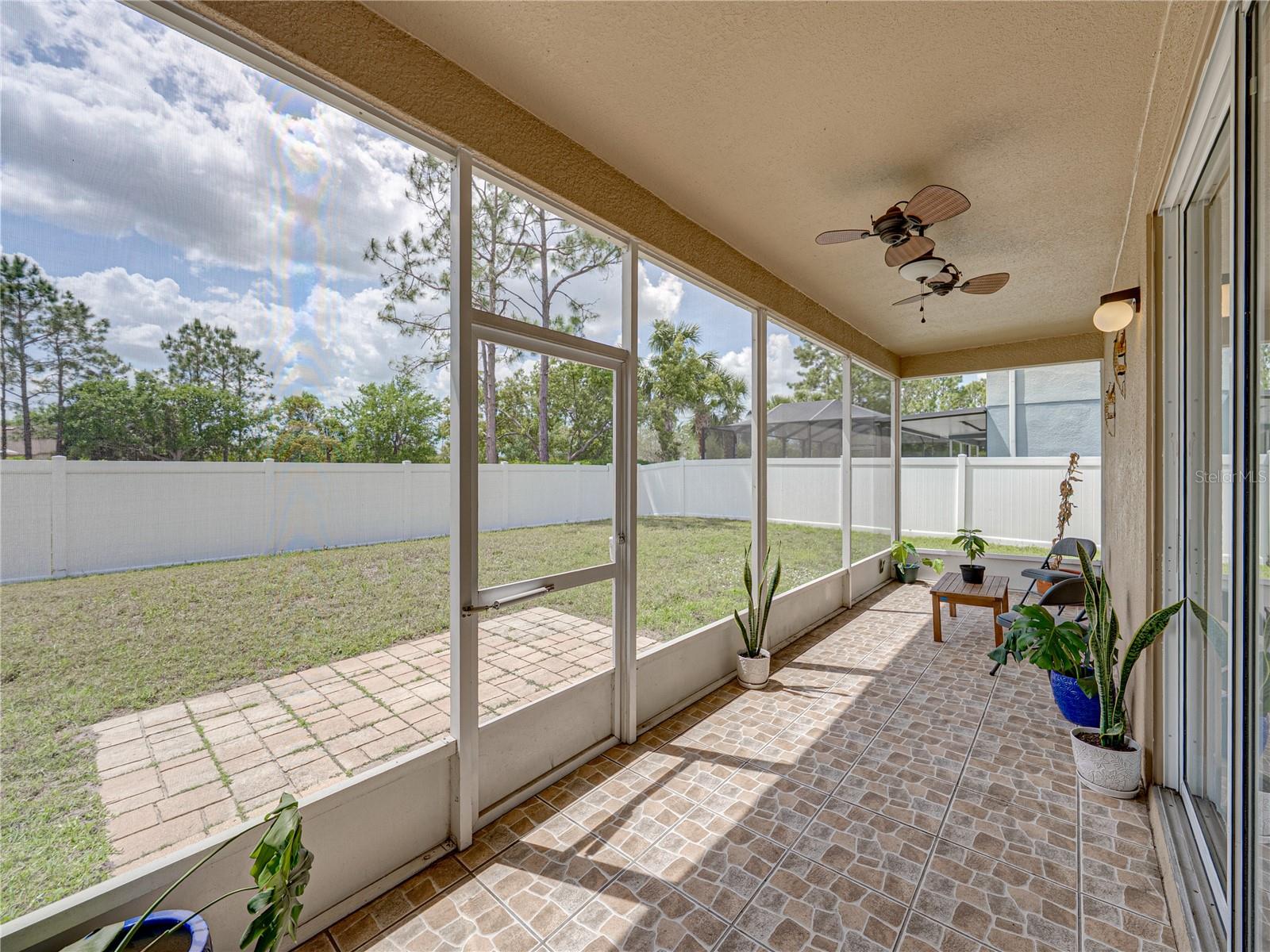 Screened Lanai overlooking fenced backyard