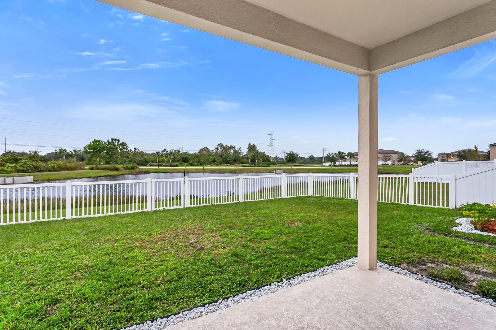Fenced yard and pond