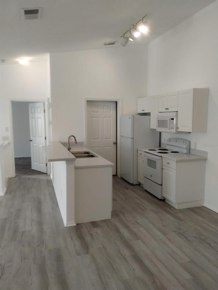 Open Concept Kitchen - Dining. Luxury Vinyl through main Living spaces