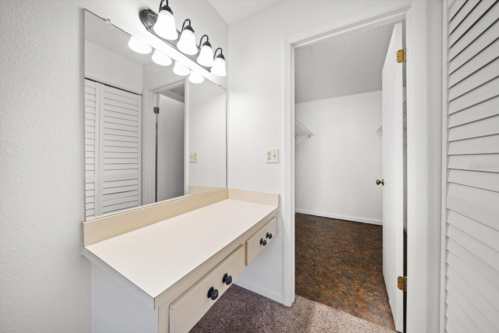 Make-Up Vanity and view of walk in closet