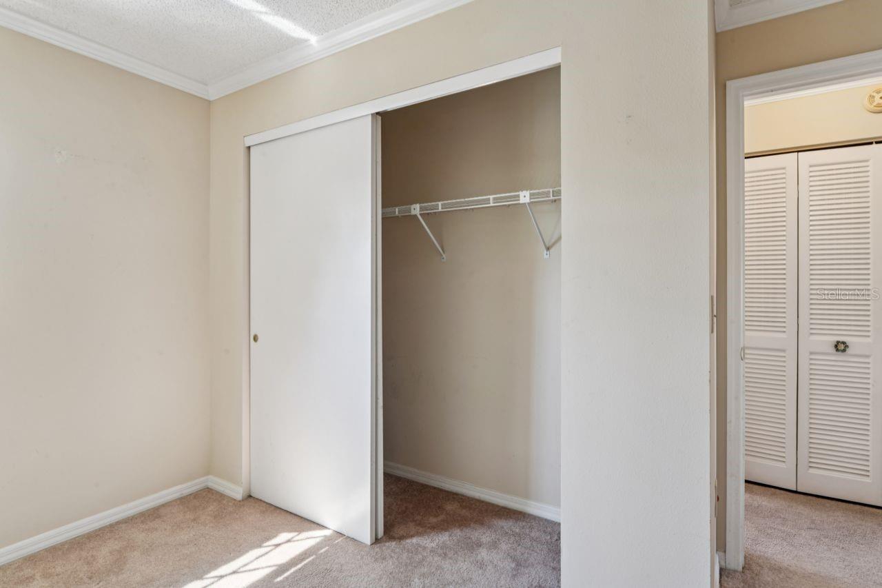 Double built-in closet with hallway entrance.