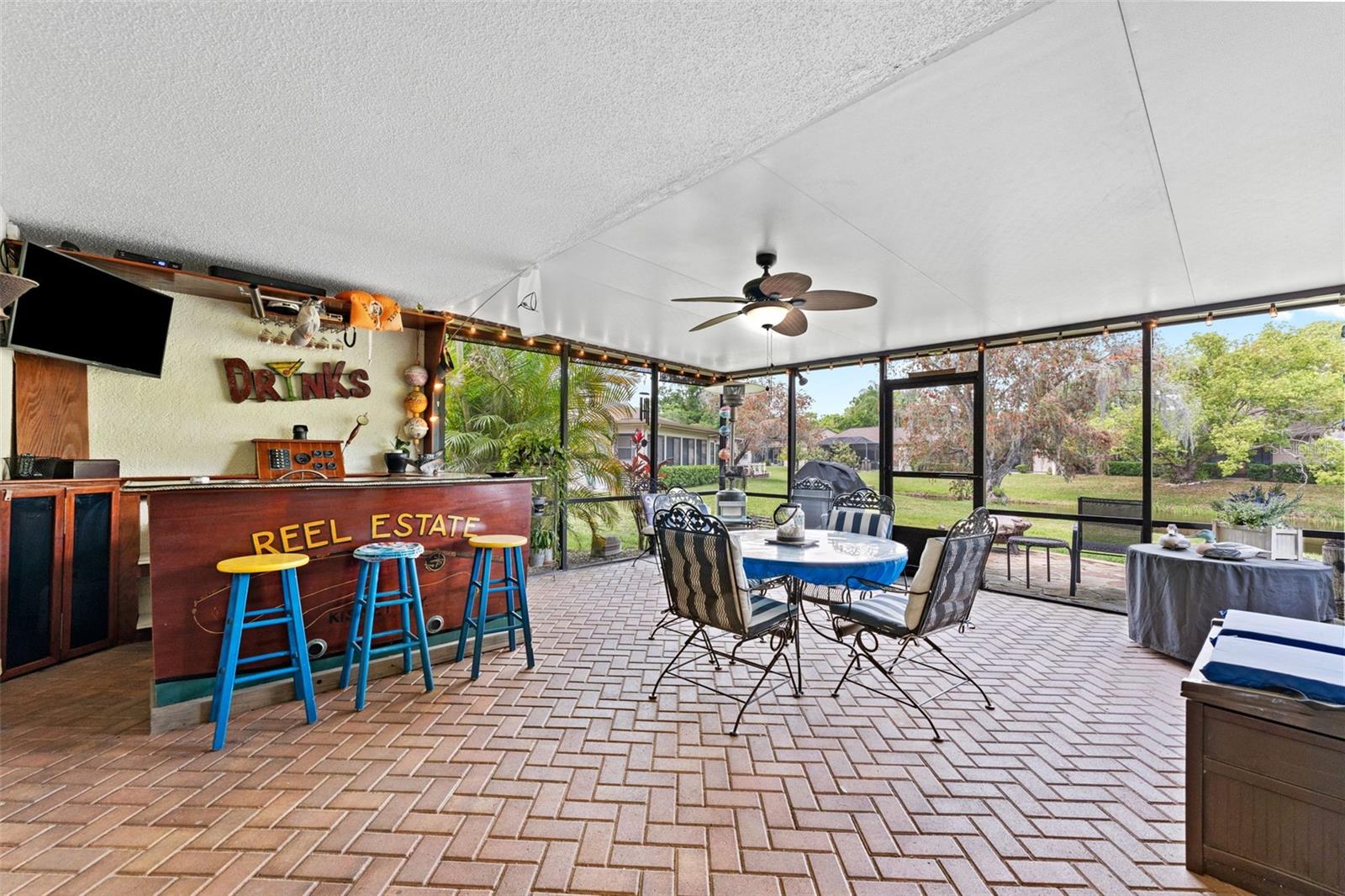 Oversized screened lanai with pond and nature views