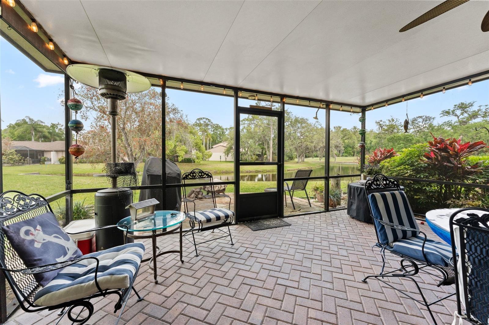 Oversized screened lanai with pond and nature views