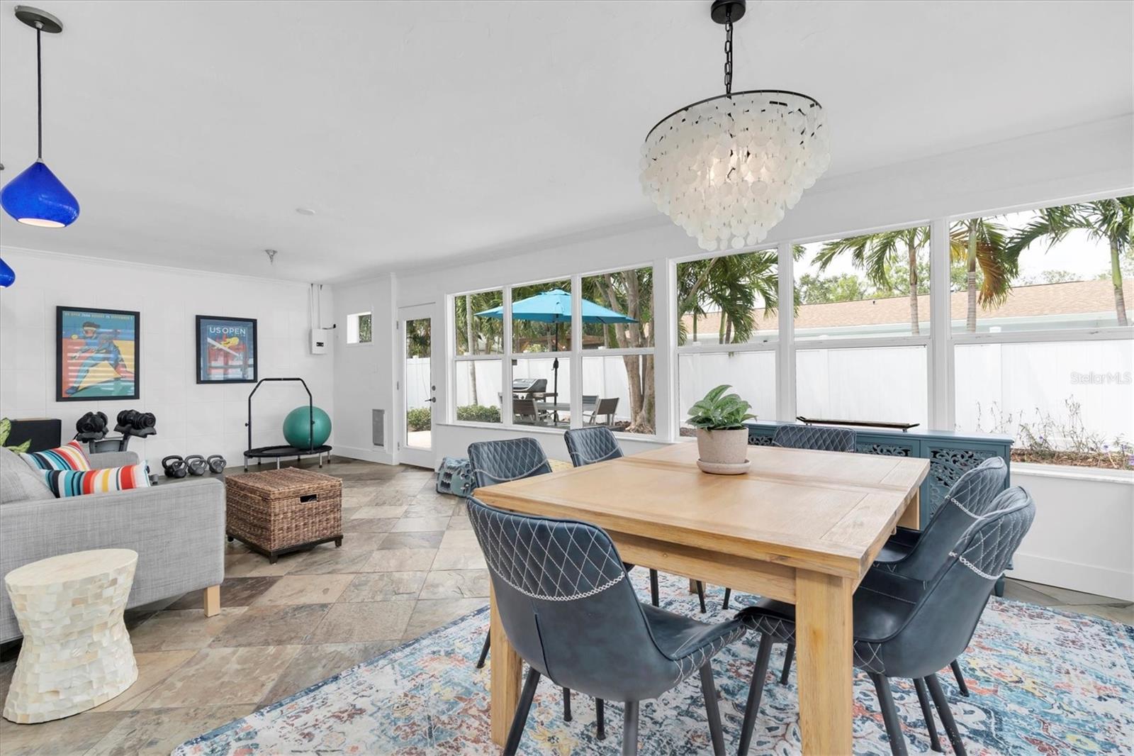 This space is very flexible...could be a gym, a home office,  family room, pool table or game room, or just the perfect spot to soak up the sun - but in the air conditioning!