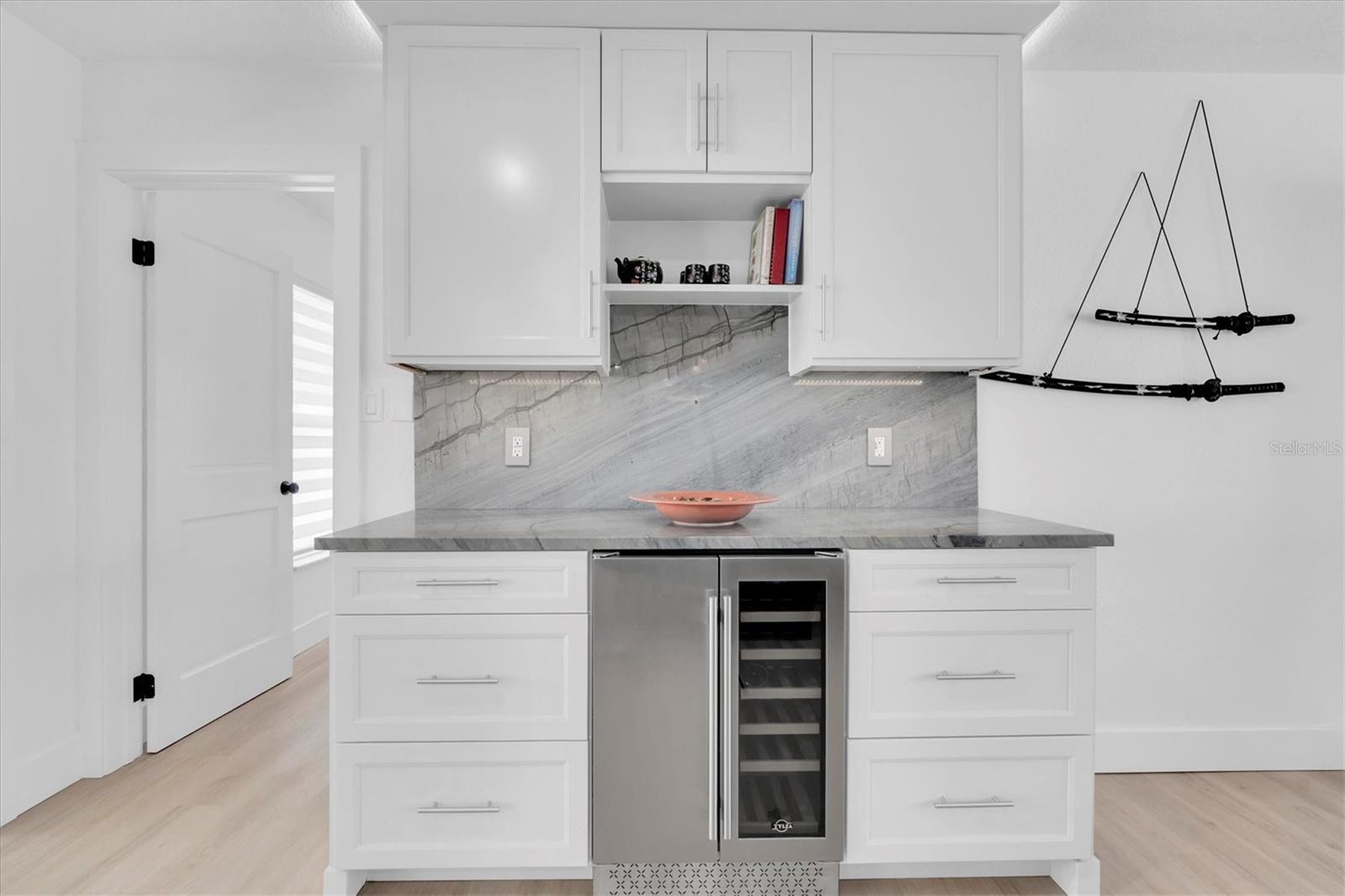 Matching dry bar with  fridge located right in the middle for easy access from anywhere.