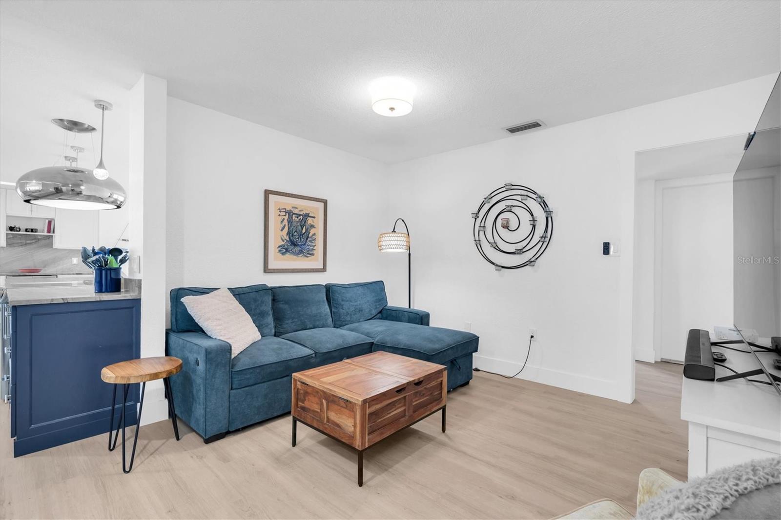 This perfect media room is tucked in right off the kitchen.  It's perfect for watching a movie and relaxing.