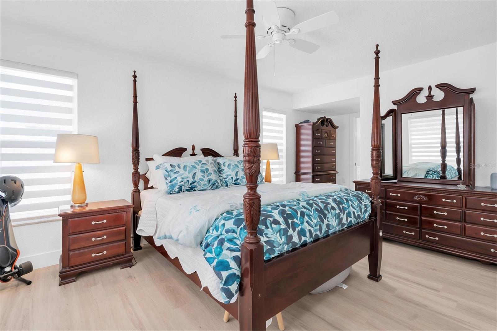 Th primary suite is king sized, has 3 big windows and a walk in closet with a closet system by Closetivity.