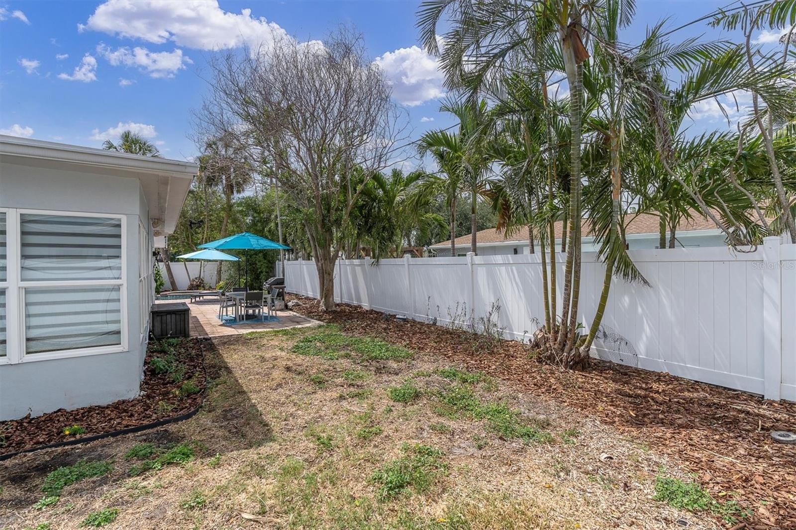 This backyard is waiting for your tropical oasis vision!