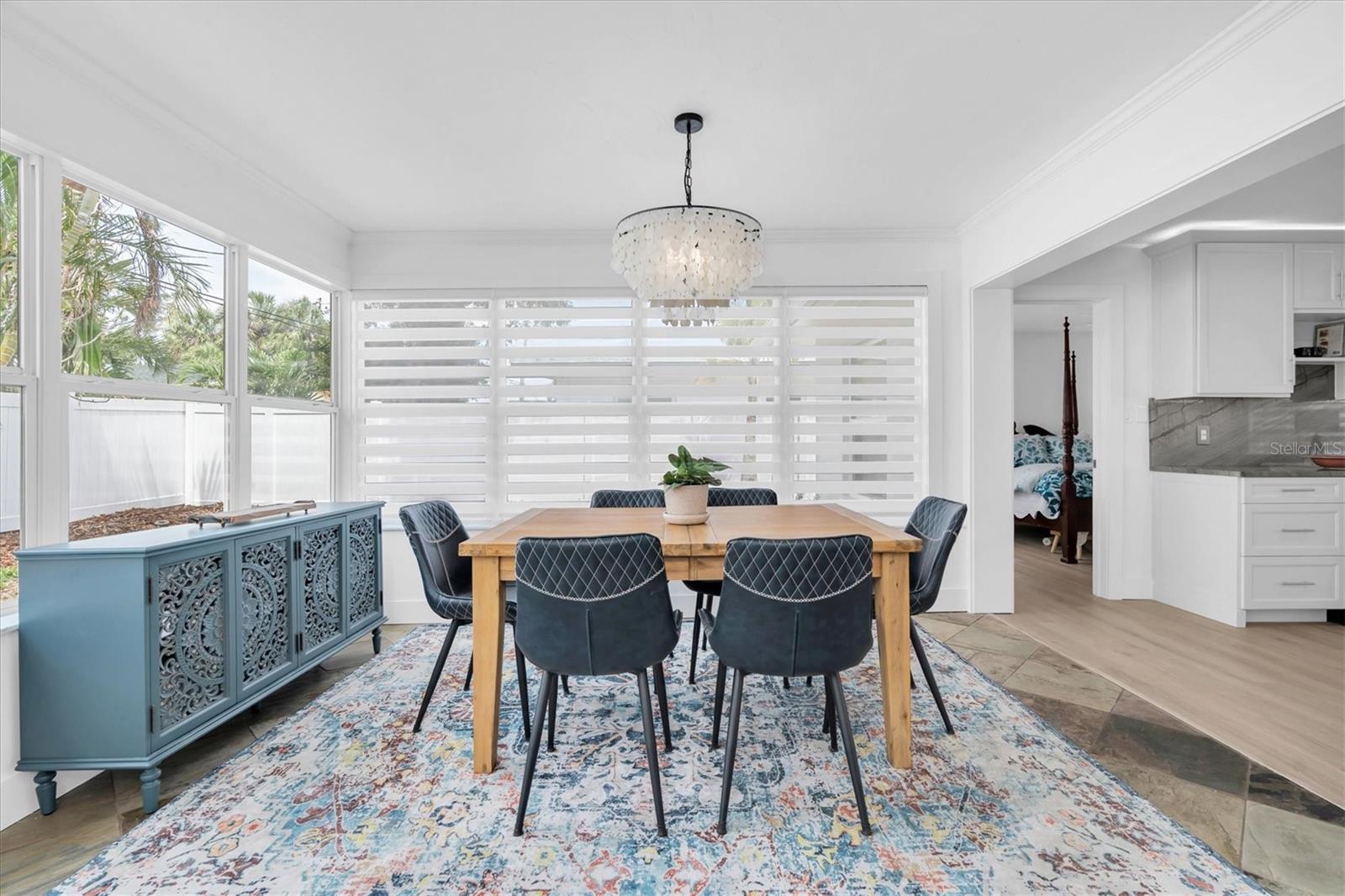 The Florida room is currently used as the dining area and makes a perfect spot for meals with the family.