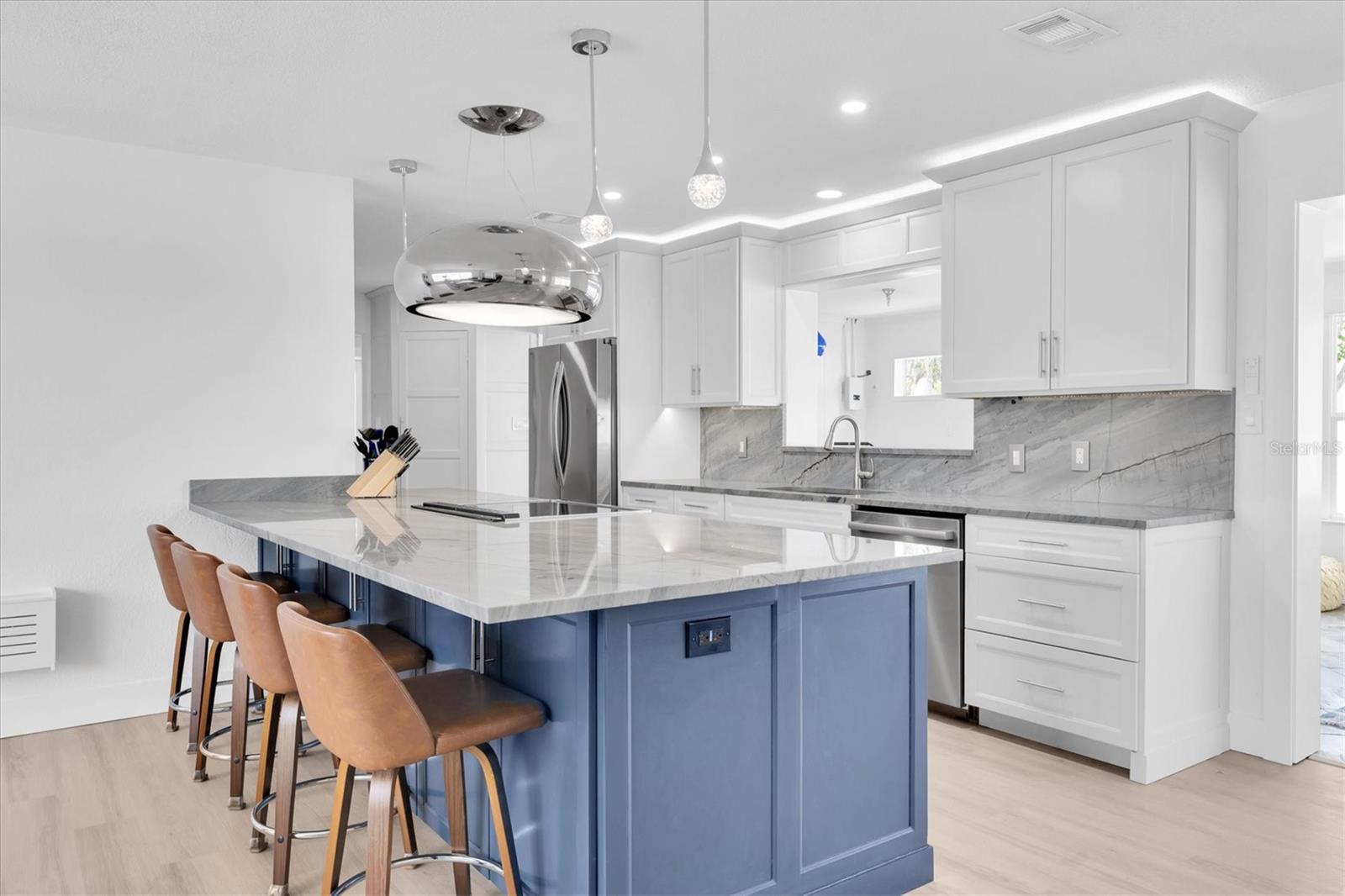 The range hood is a statement piece in this kitchen!