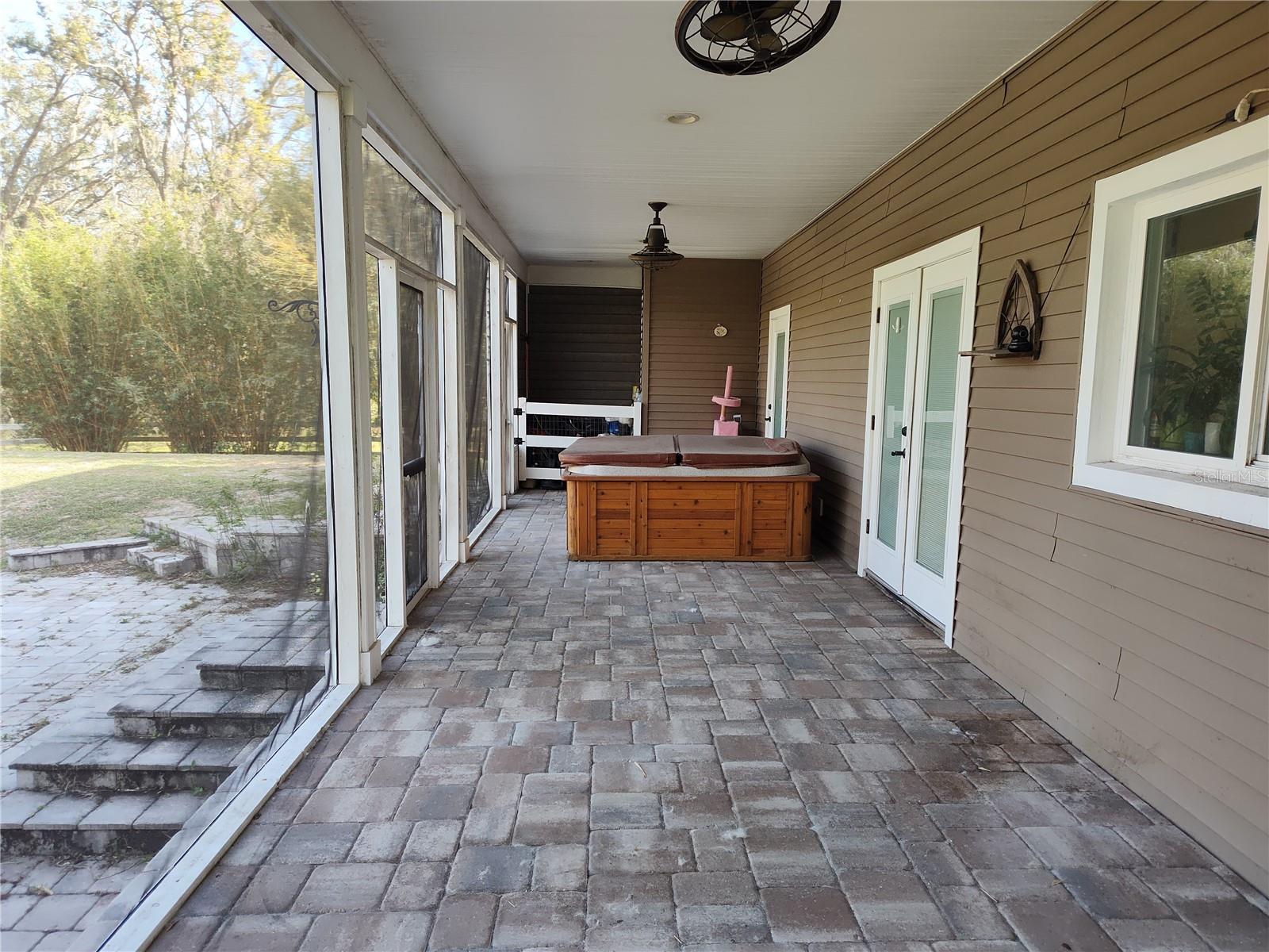 Rear covered patio and hot tub view