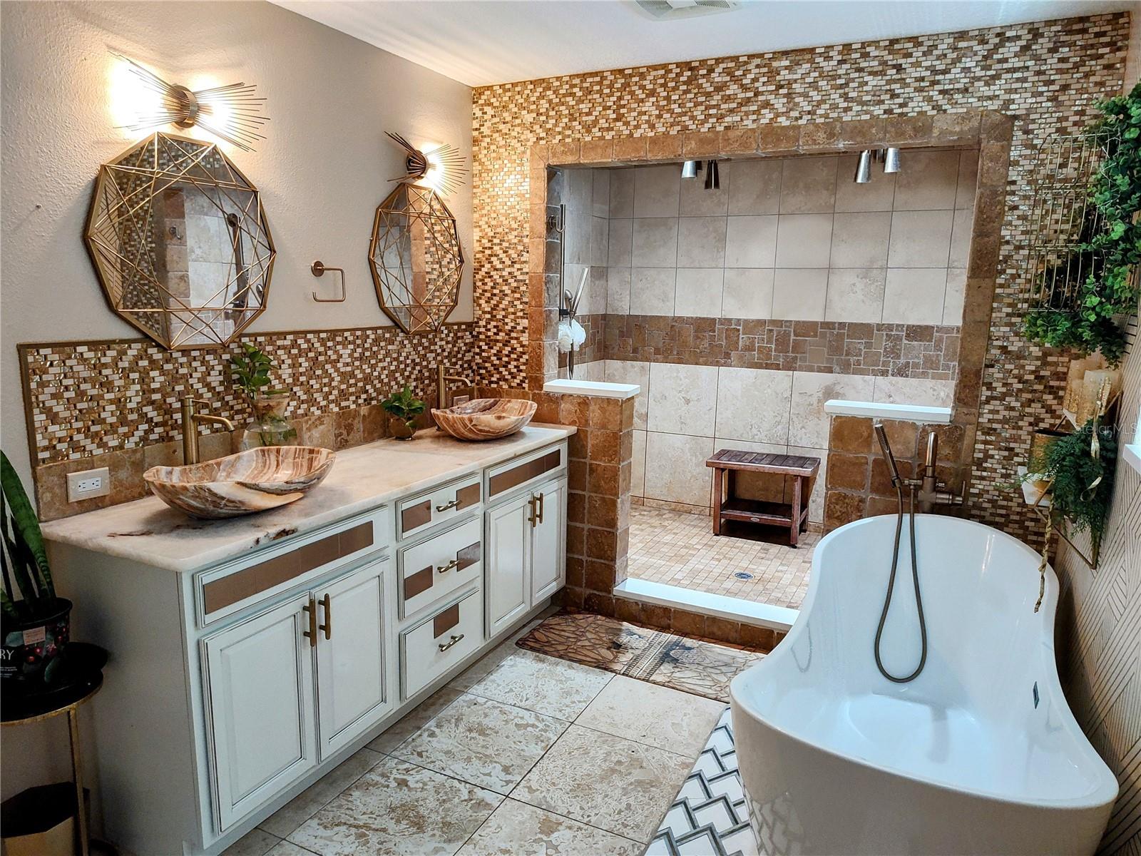 Primary bathroom with tub and shower