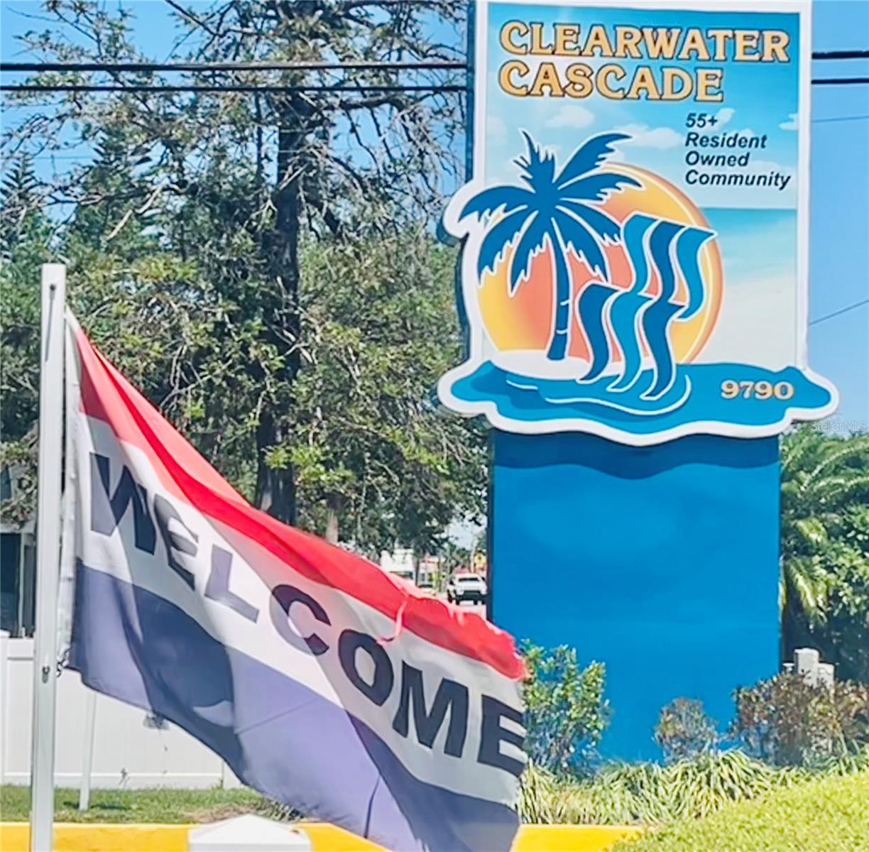 Entry sign with welcome flag
