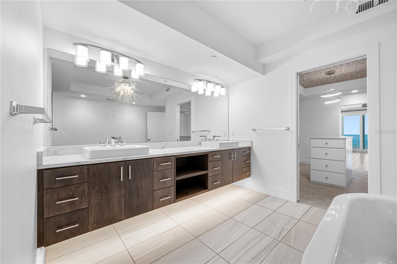 Master Bath with a double vanity and floating cabintes