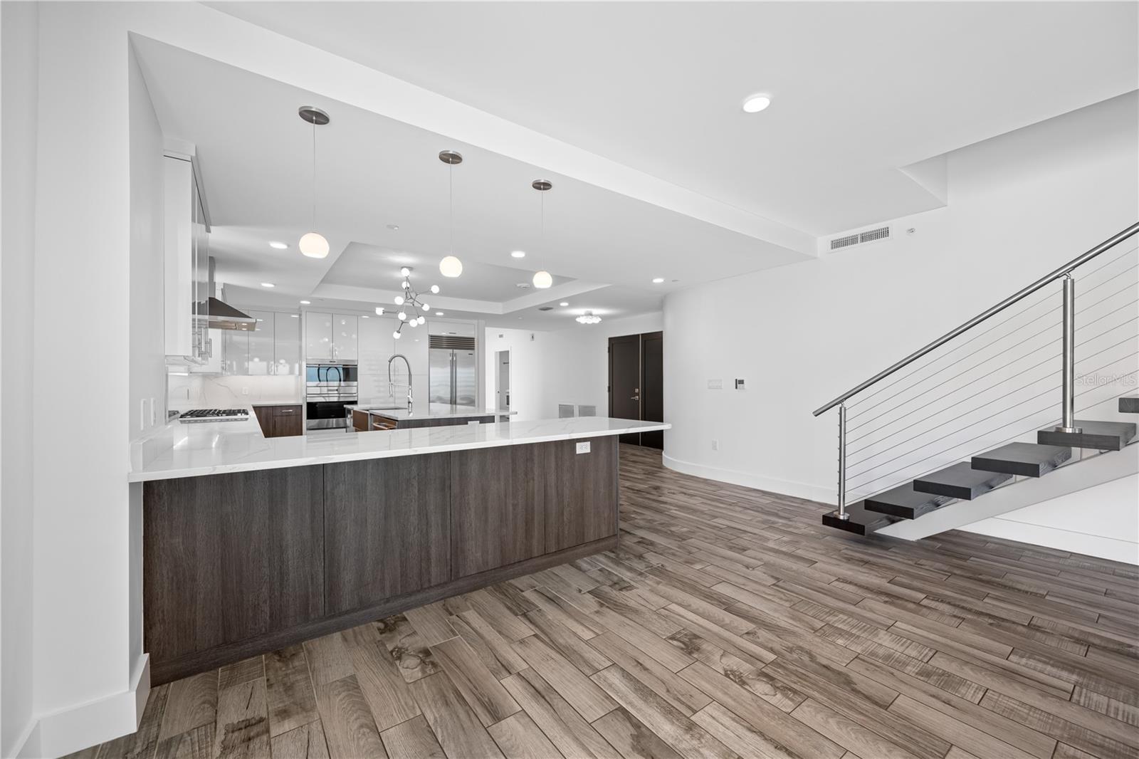 Floating staircase leading to Guest Suite/Family Room