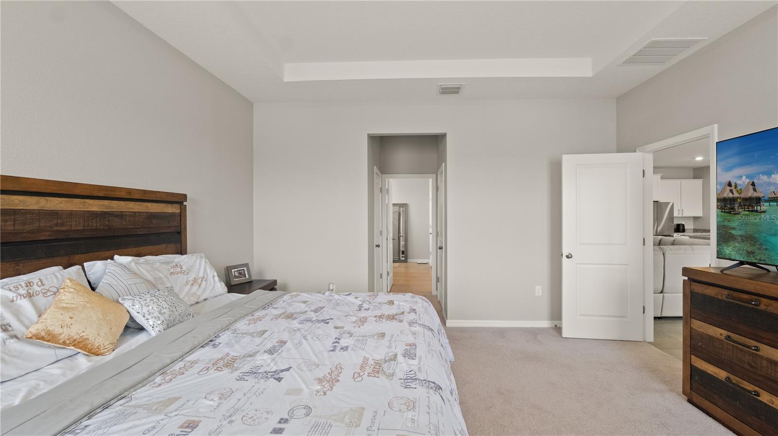 Primary Bedroom with Tray Ceilings, Pond Views, EnSuite, Dual Closets