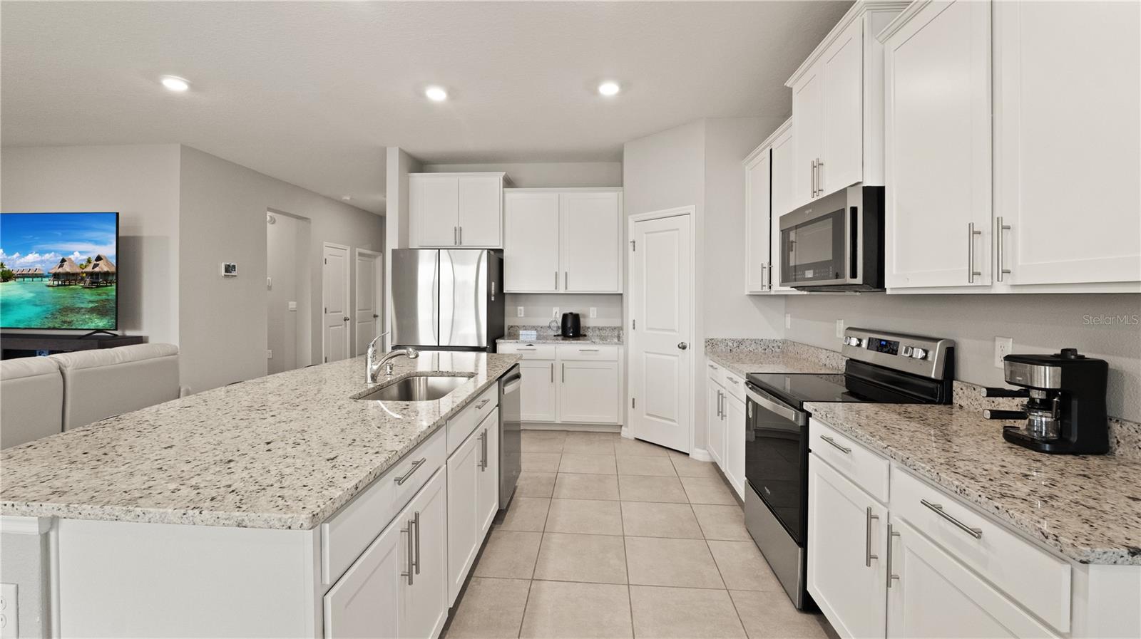 Kitchen with Pond Views, Granite Counters, Stainless Steel Appliances