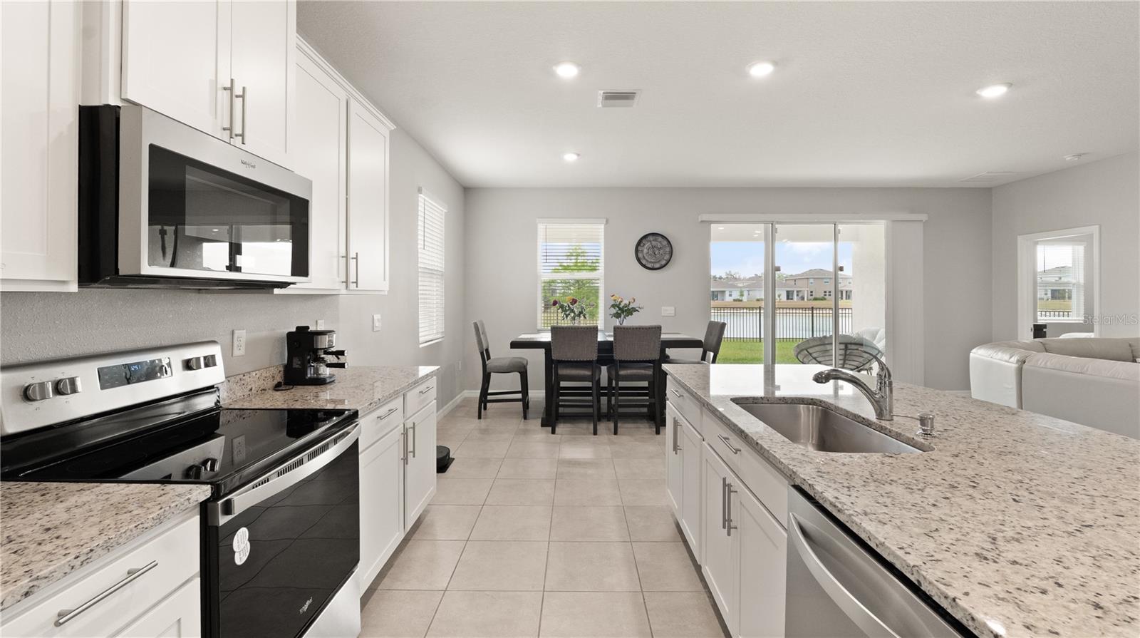 Kitchen with Pond Views, Granite Counters, Stainless Steel Appliances