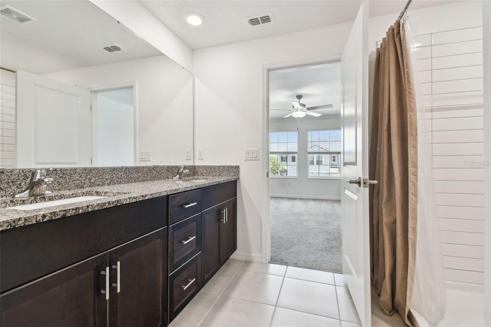 Primary bathroom w dual sinks & shower