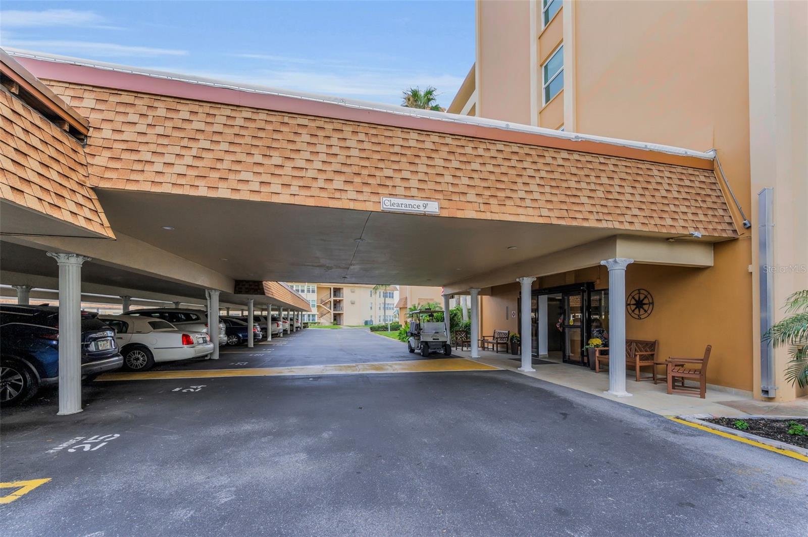 Covered parking space #32, steps away from building entryway.
