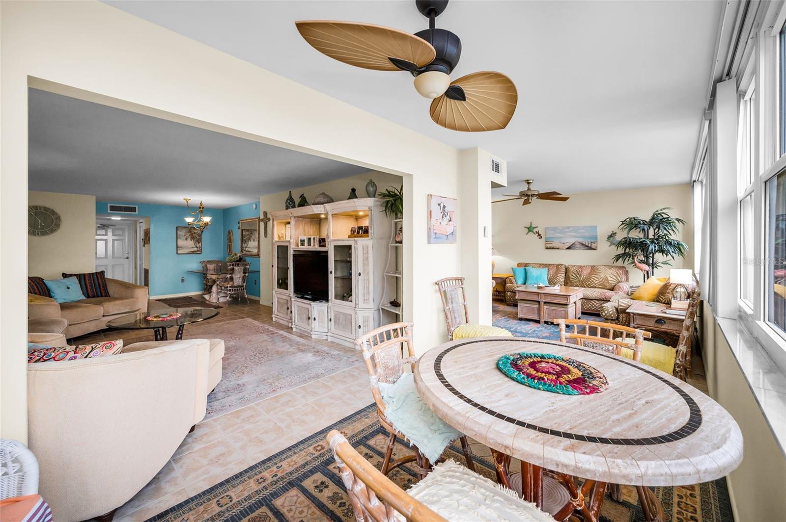 Living area with adjacent sunroom leading to the Family Room.