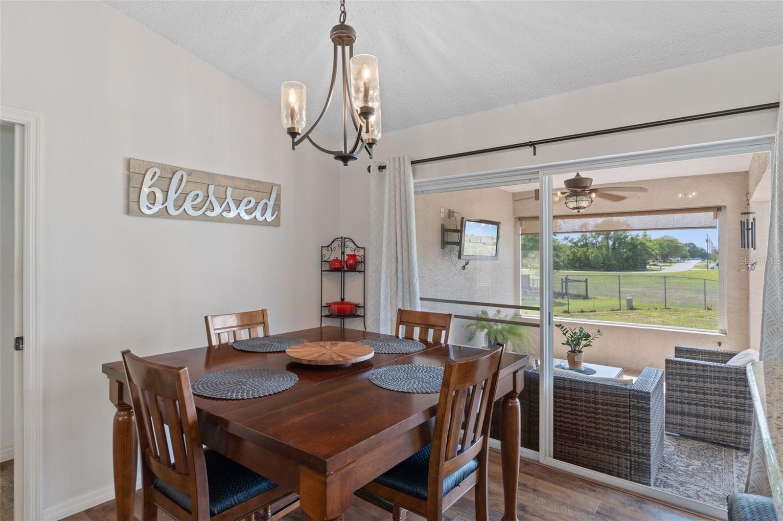There are sliding glass doors from the dining area to your gorgeous covered patio and huge screened in porch area !!