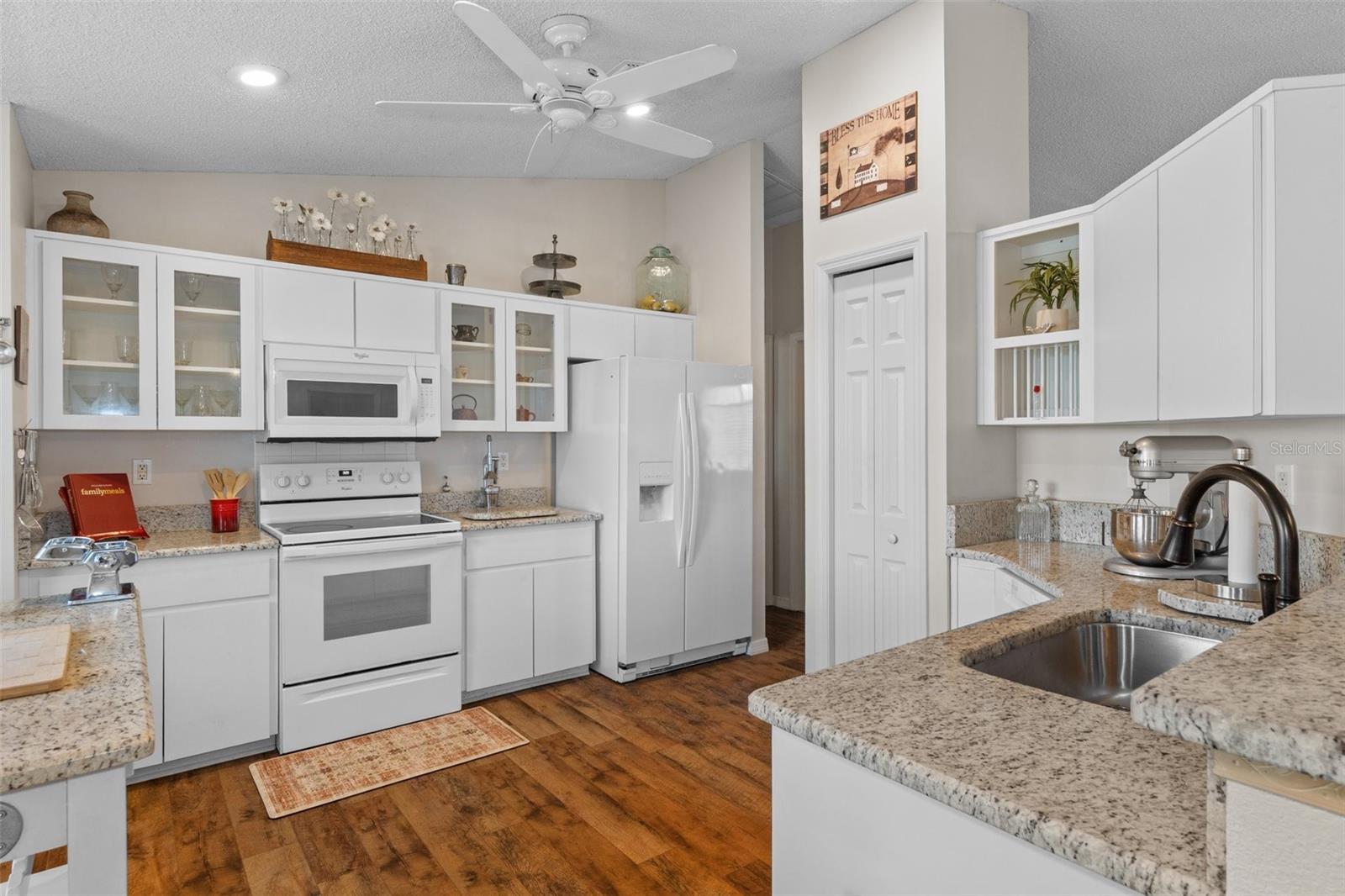 Notice the gorgeous cabinets with glass doors