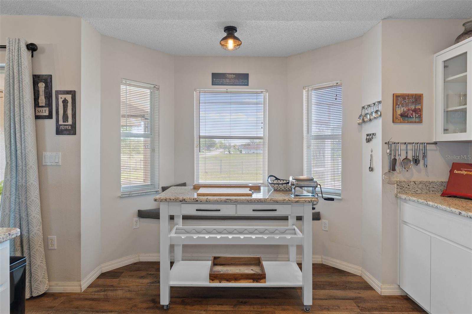 This Gorgeous Custom made kitchen island with matching marble top stays with the home !!