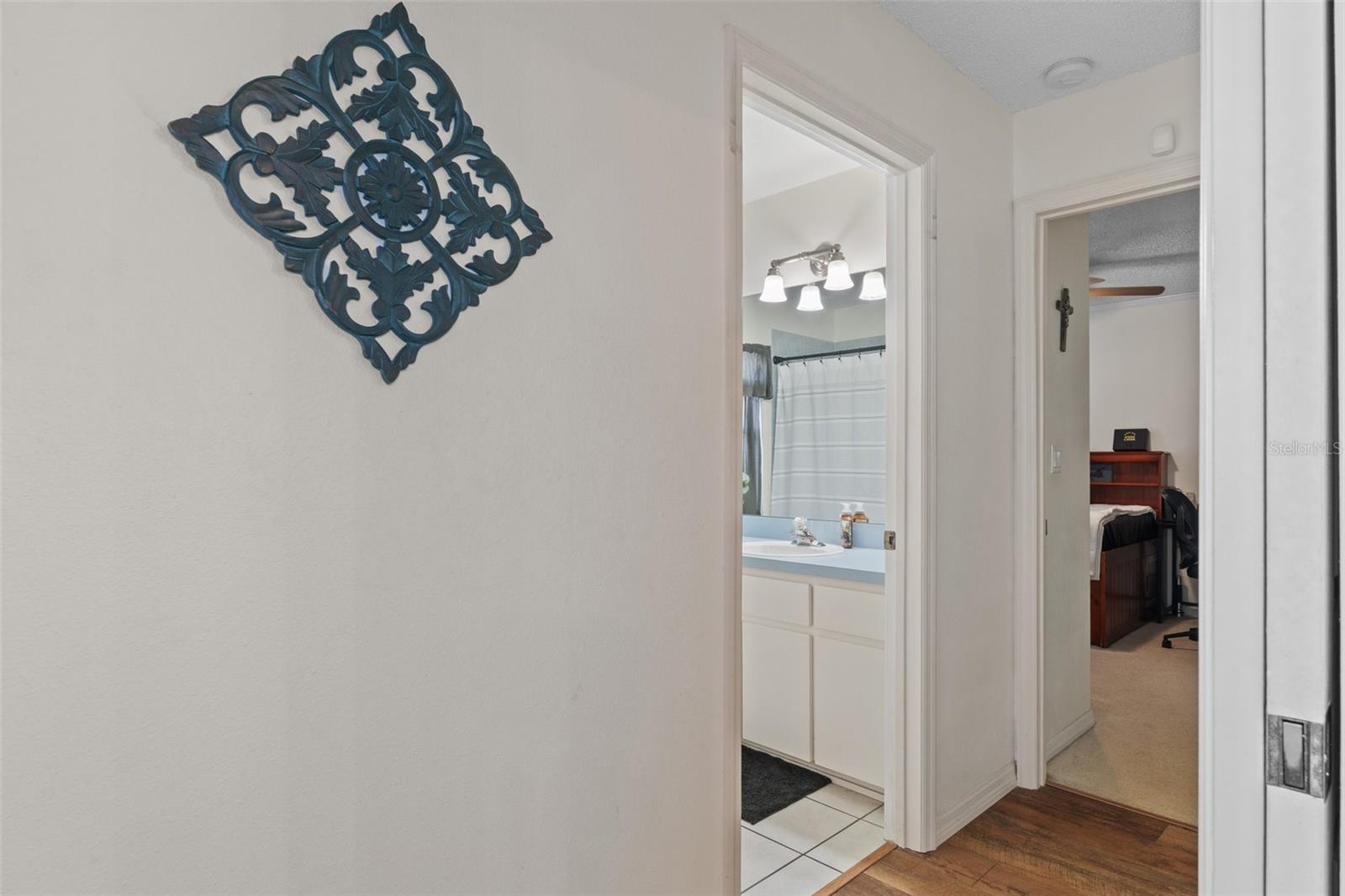 Hallway to the other 2 bedrooms and guest bathroom