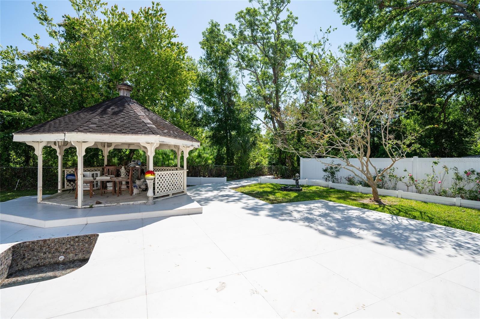 The other side of the backyard, You can see a little part of the pool to the left.
