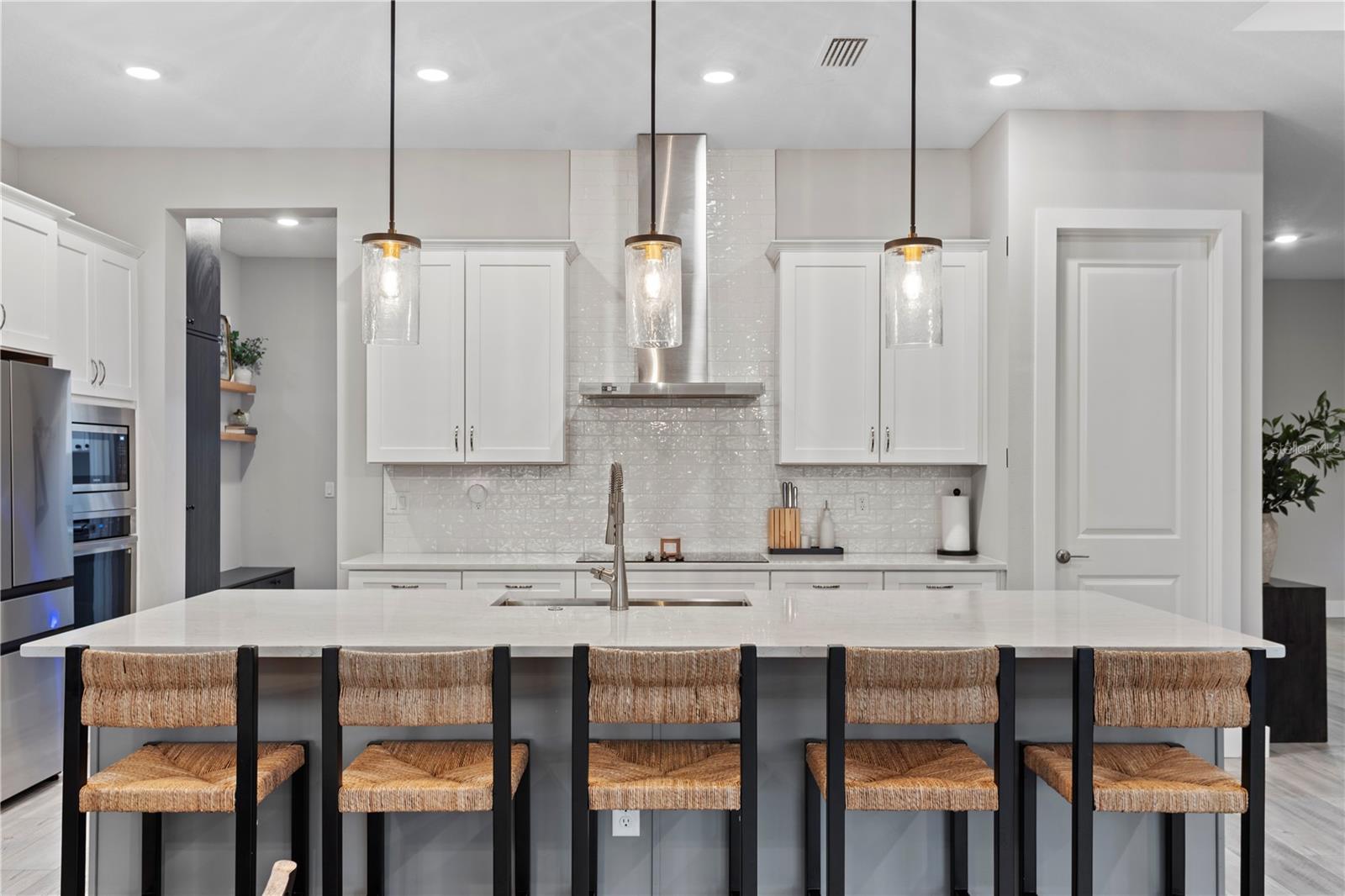 Large island with seating and sleek countertops!