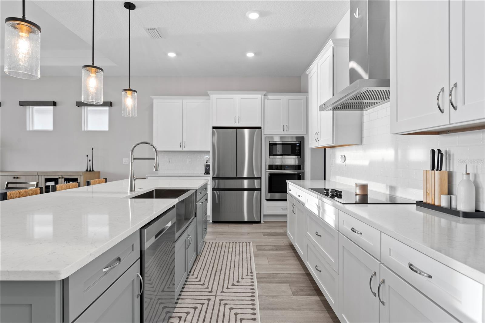 High-end appliances and a custom walk-in pantry with built-in shelving!