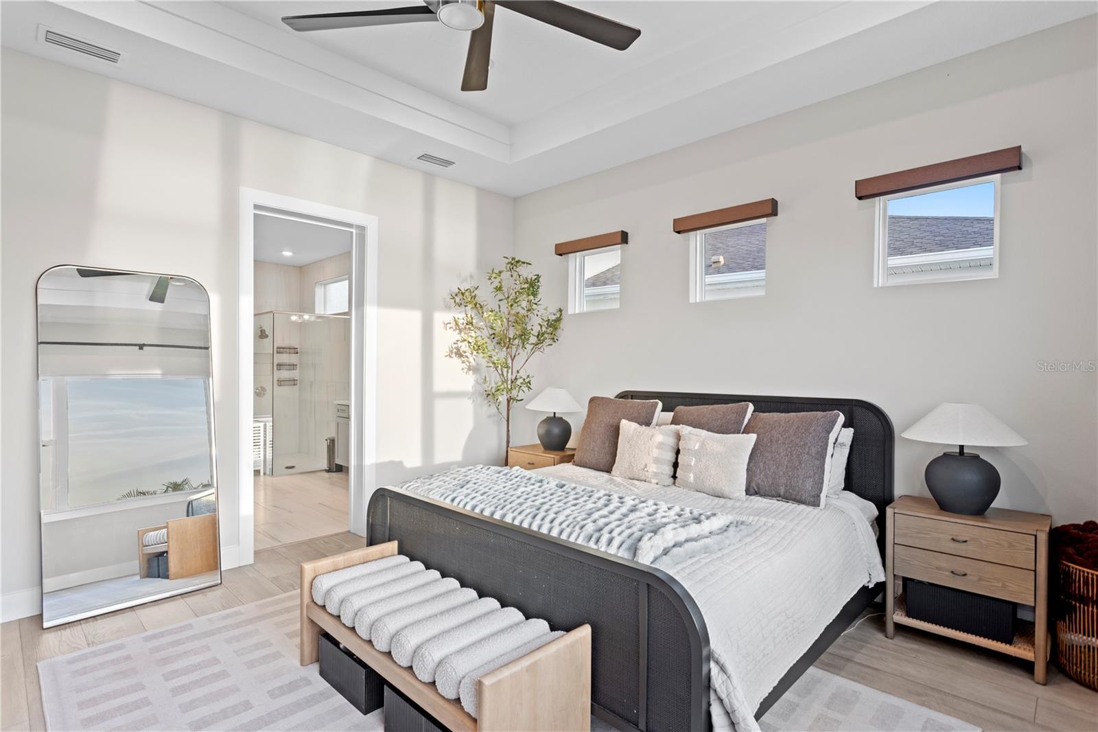 High ceiling and large windows flood the space with natural light!