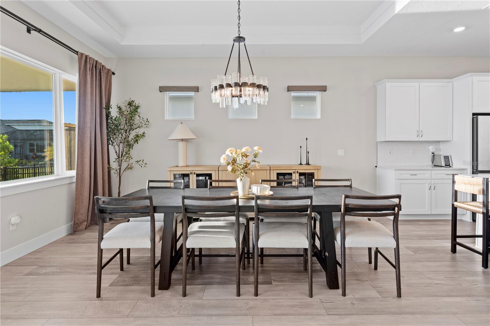 Dining room with natural light and modern charm, ready for memorable gatherings!