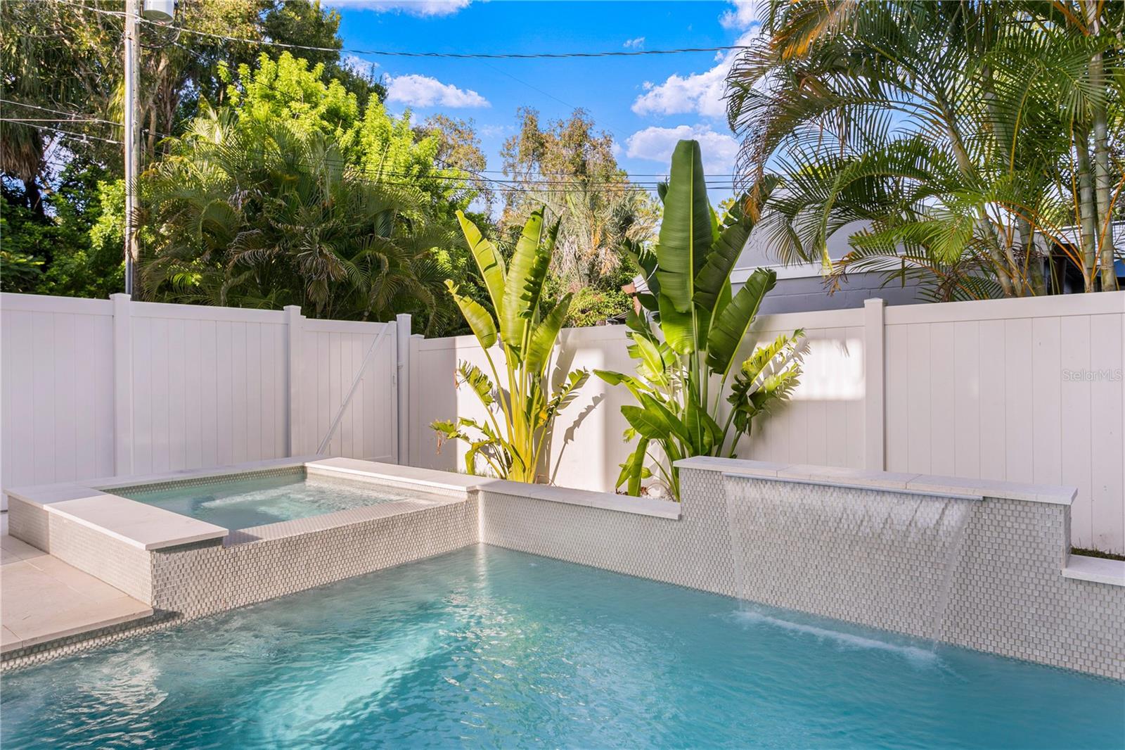 Swimming pool with spa and water feature