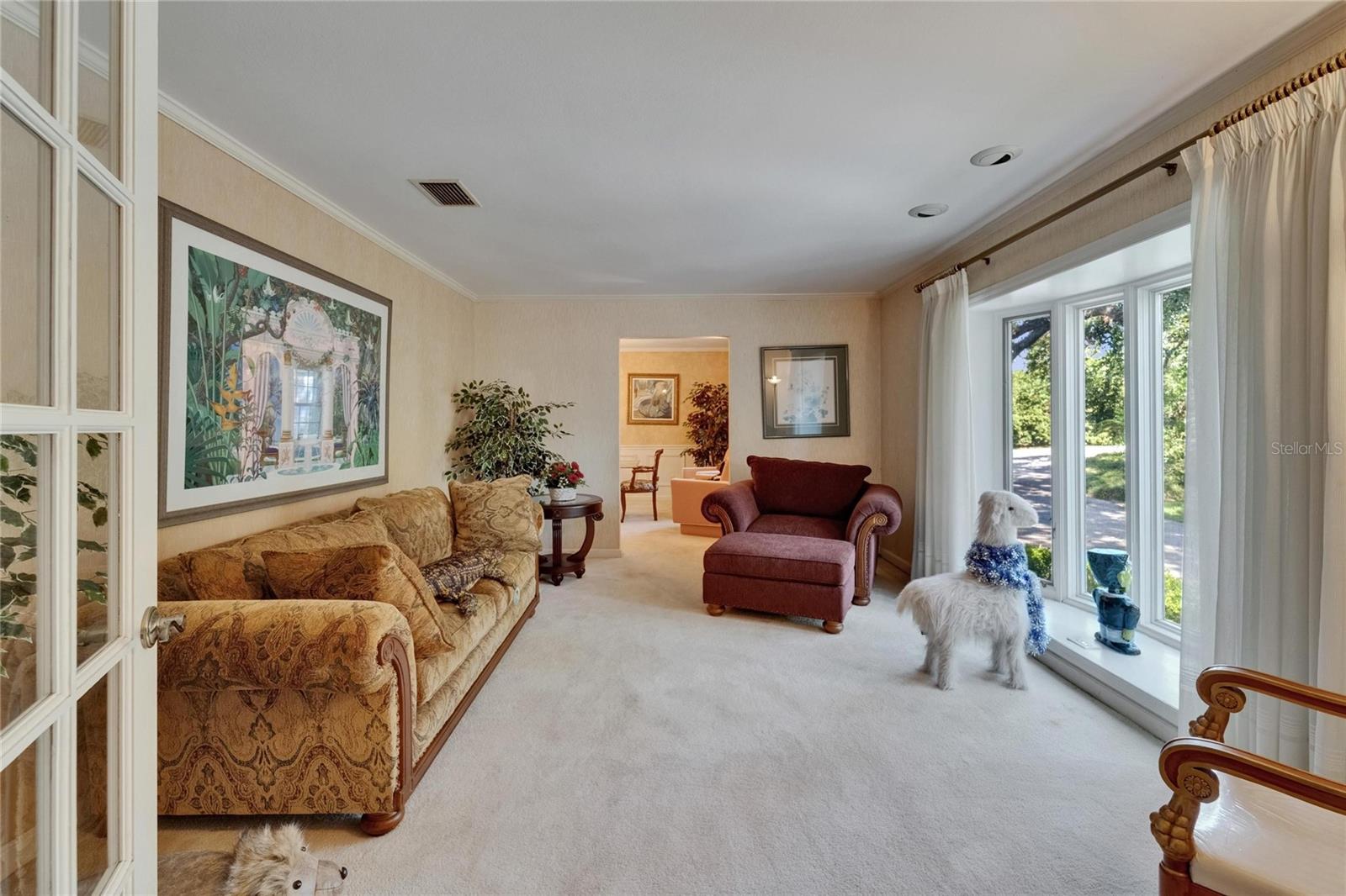 Living Room overlooking front grounds through Bay Window