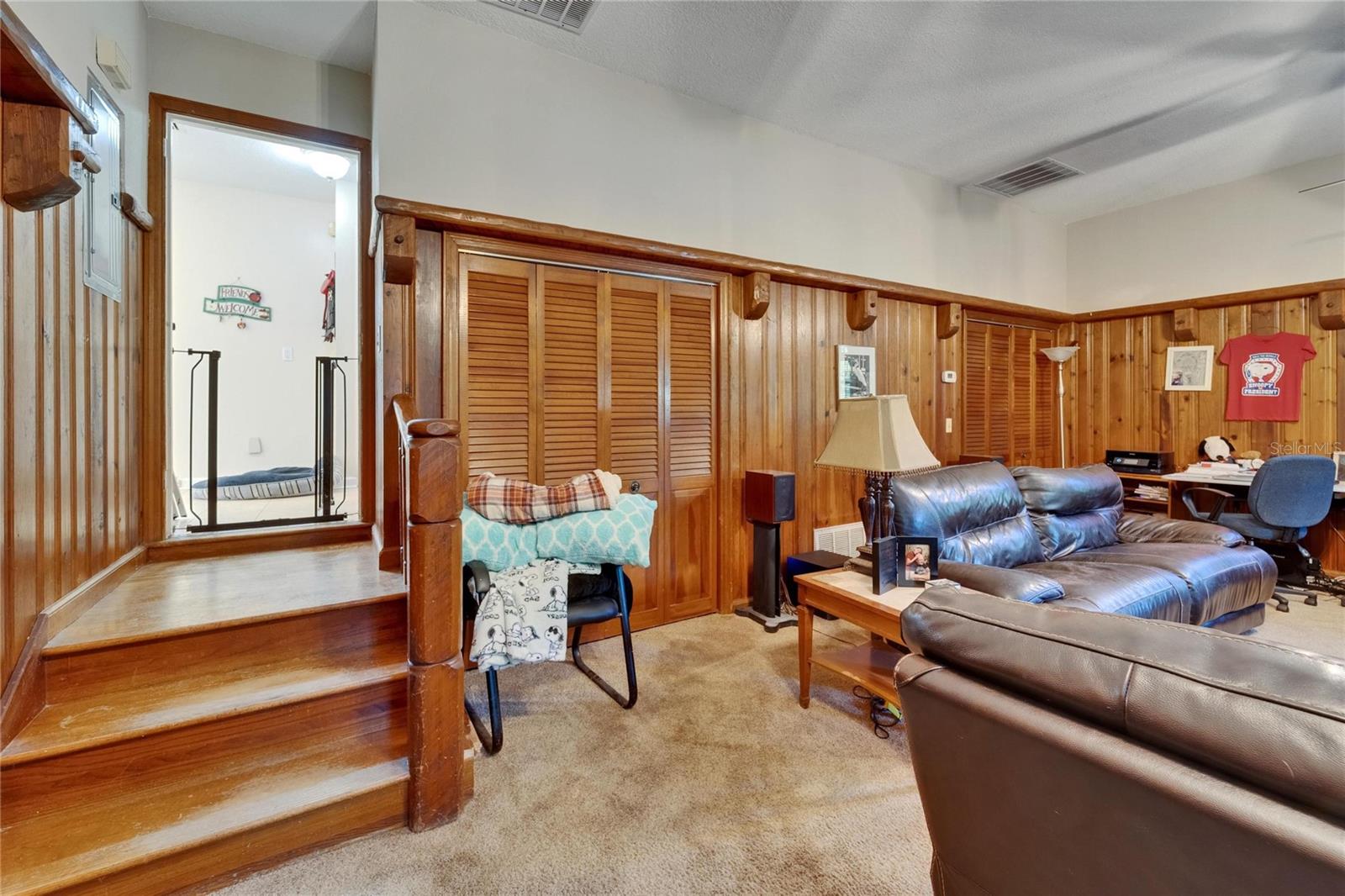 Sunken area with elaborate wood staircase