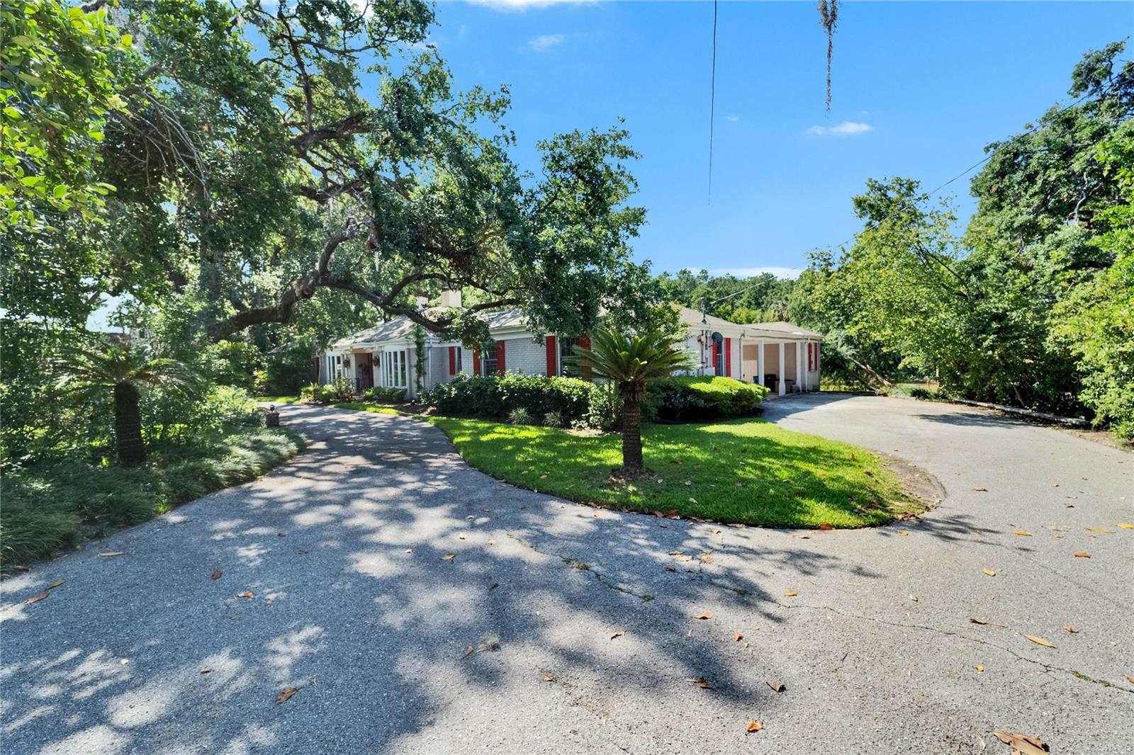 Circular driveway: left is main entrance-right is (3) car carport & garage/storage