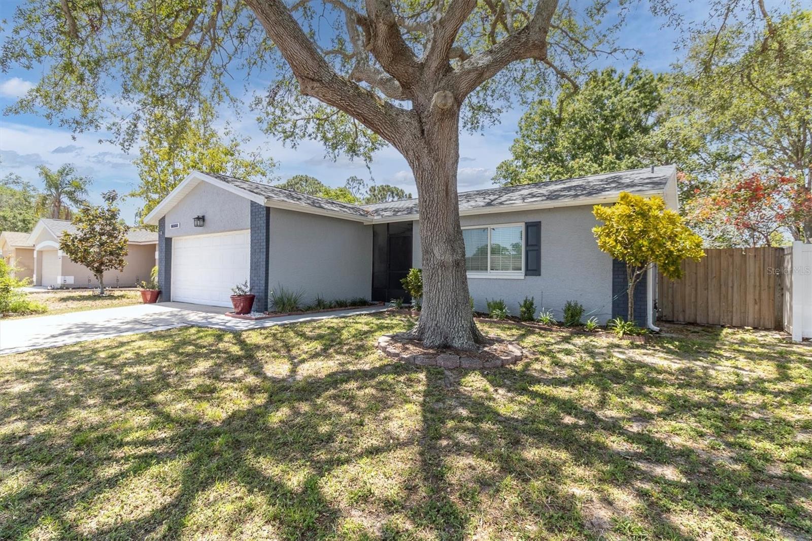 Front of the house with mature land scapping.