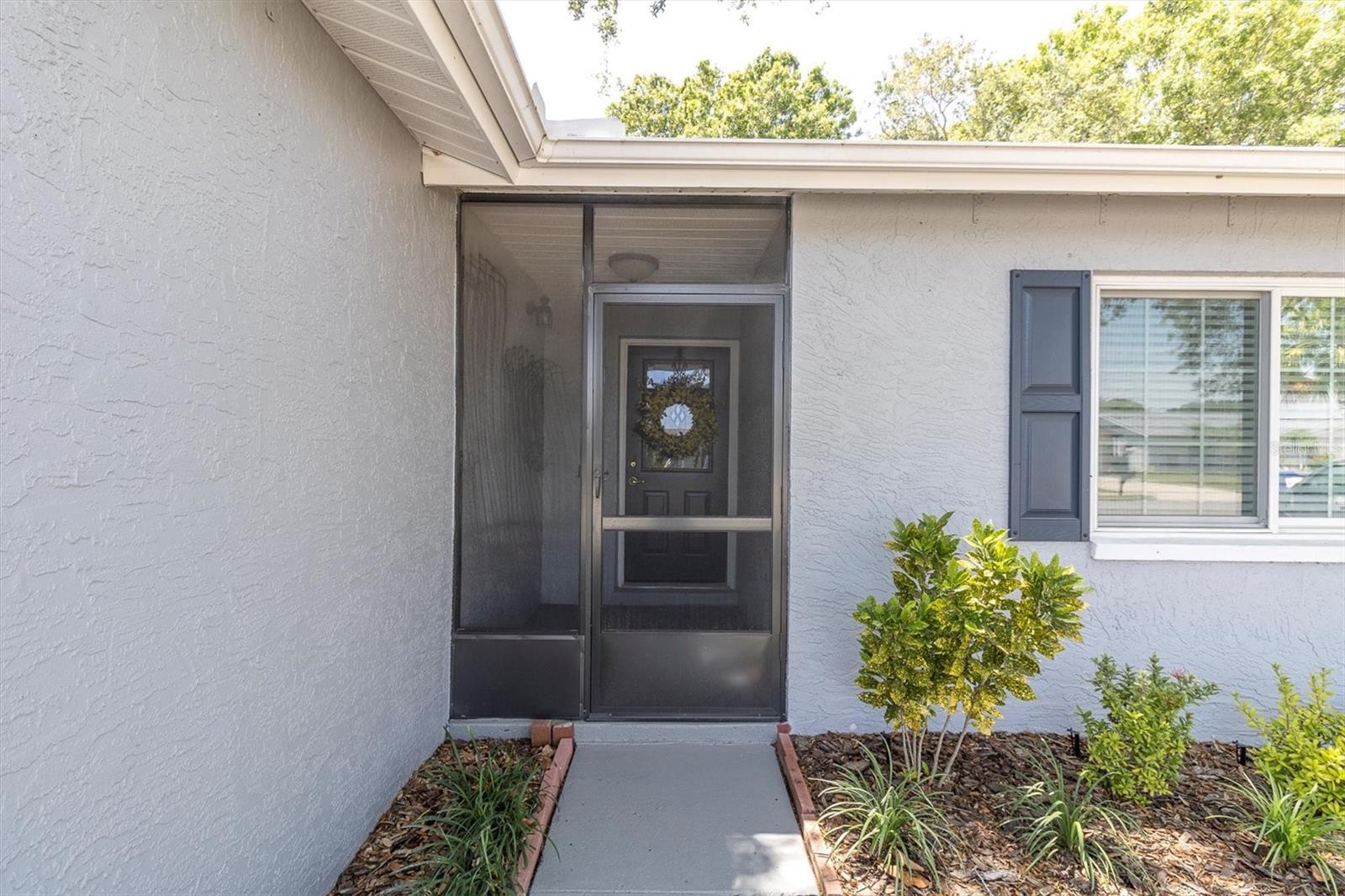 Front Entry way , Newer Anderson hurricane rated windows.