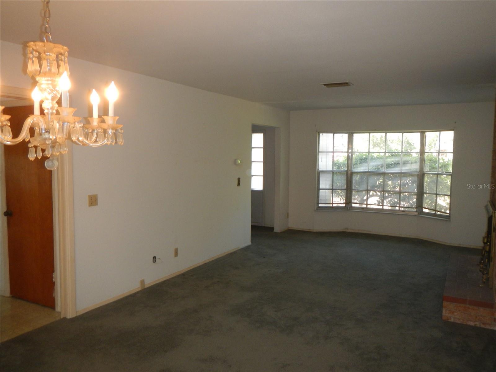 Formal Dining Area with pocket door to Kitchen.