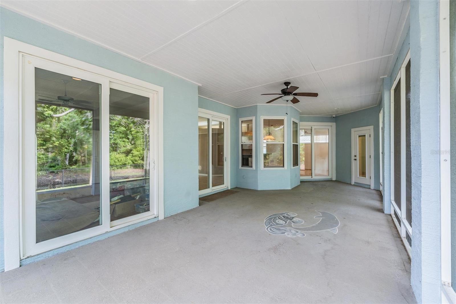 Large lanai with 3 hurricane resistance double pane slider doors and 1 bathroom door. There is a 220 amp in the right corner to possible have a hot tub.