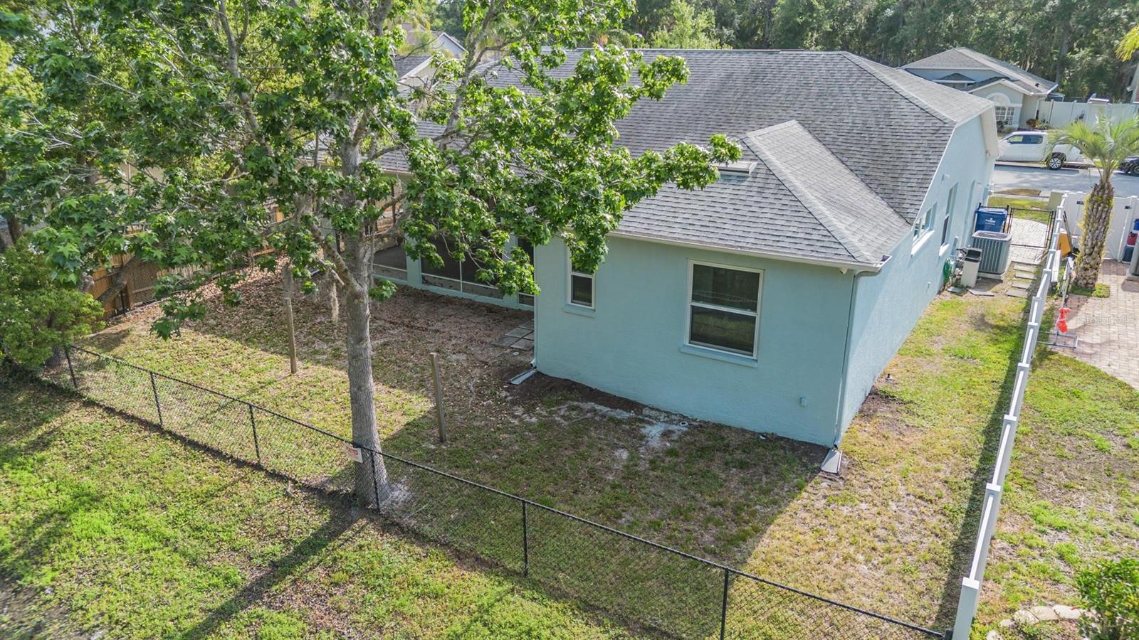 Fenced yard.  HOA maintenance the pond and grass area.... Just enjoy the view!!! Looking at Bedroom 2.