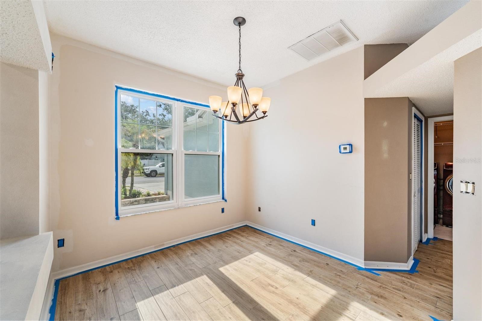 Owner is currently painting the interior. Newer light in Dining area.  Front door to the left.